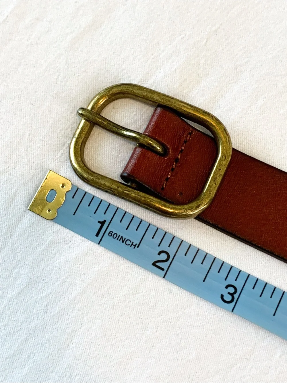 Gap leather belt in cognac red-brown color with brass tone buckle, medium